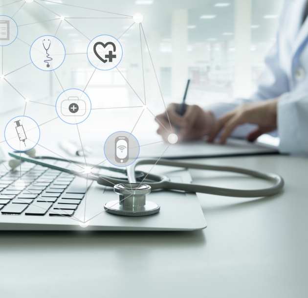 artistic image showing stethoscope resting on laptop with health icons superimposed