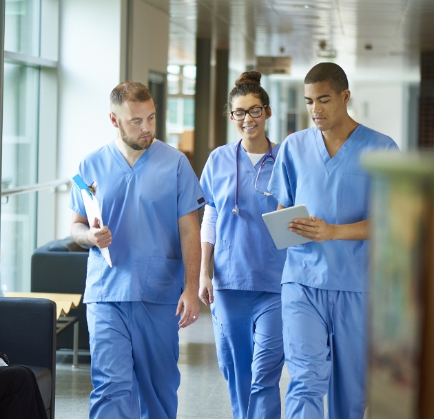 image of doctors walking down hallway